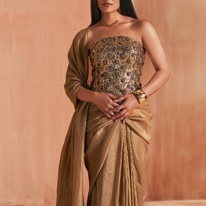Elegant Gold Embellished Women’s Saree